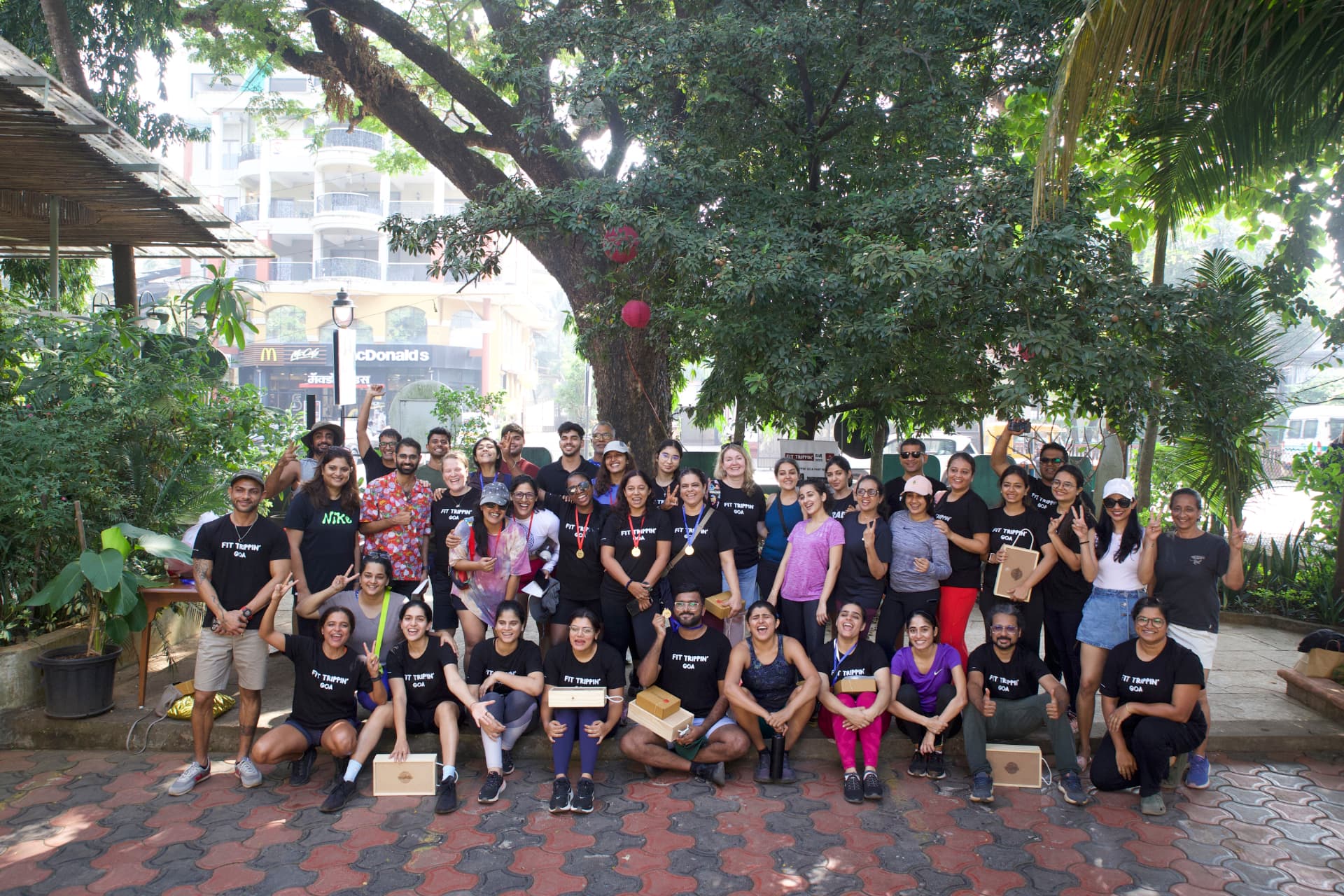 FIT TRIPPIN' Goa teams gathered under a tree after the race